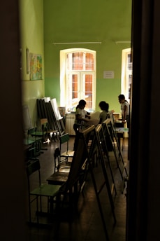 a group of people sitting at tables in a room