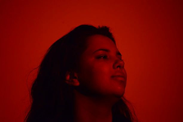 Portrait of confident doctor with dramatic lighting highlighting expertise.