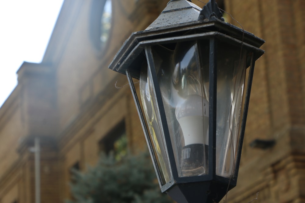 a street light is stationed on a pole