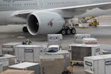 a large airplane is being loaded with luggage
