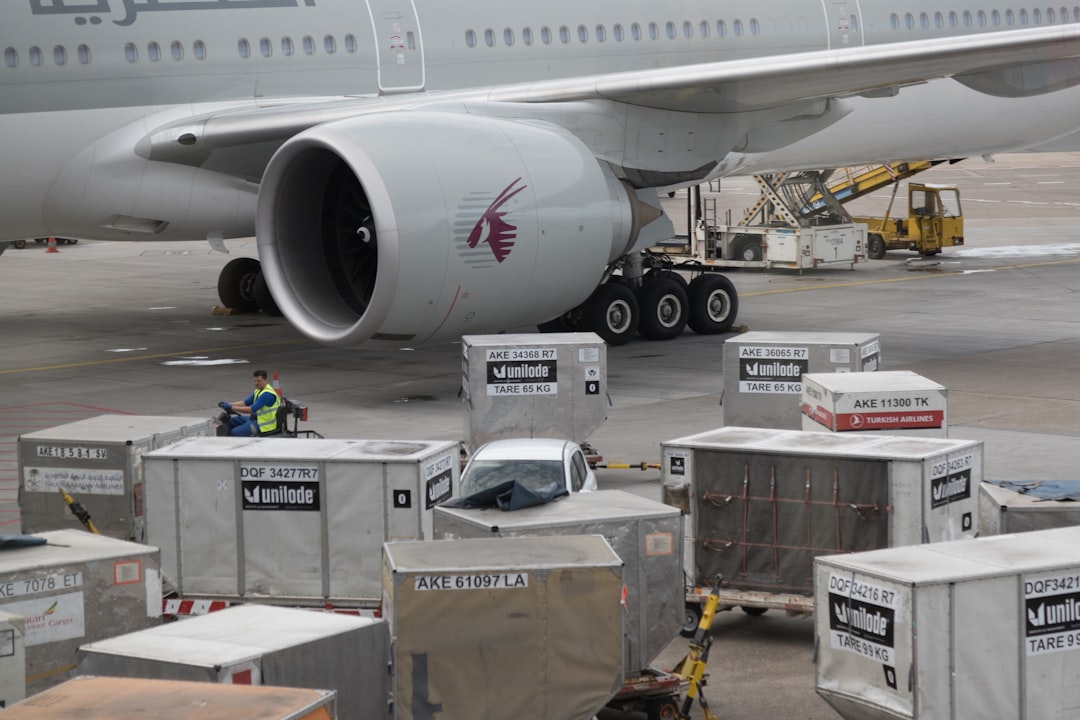 a large airplane is being loaded with luggage,