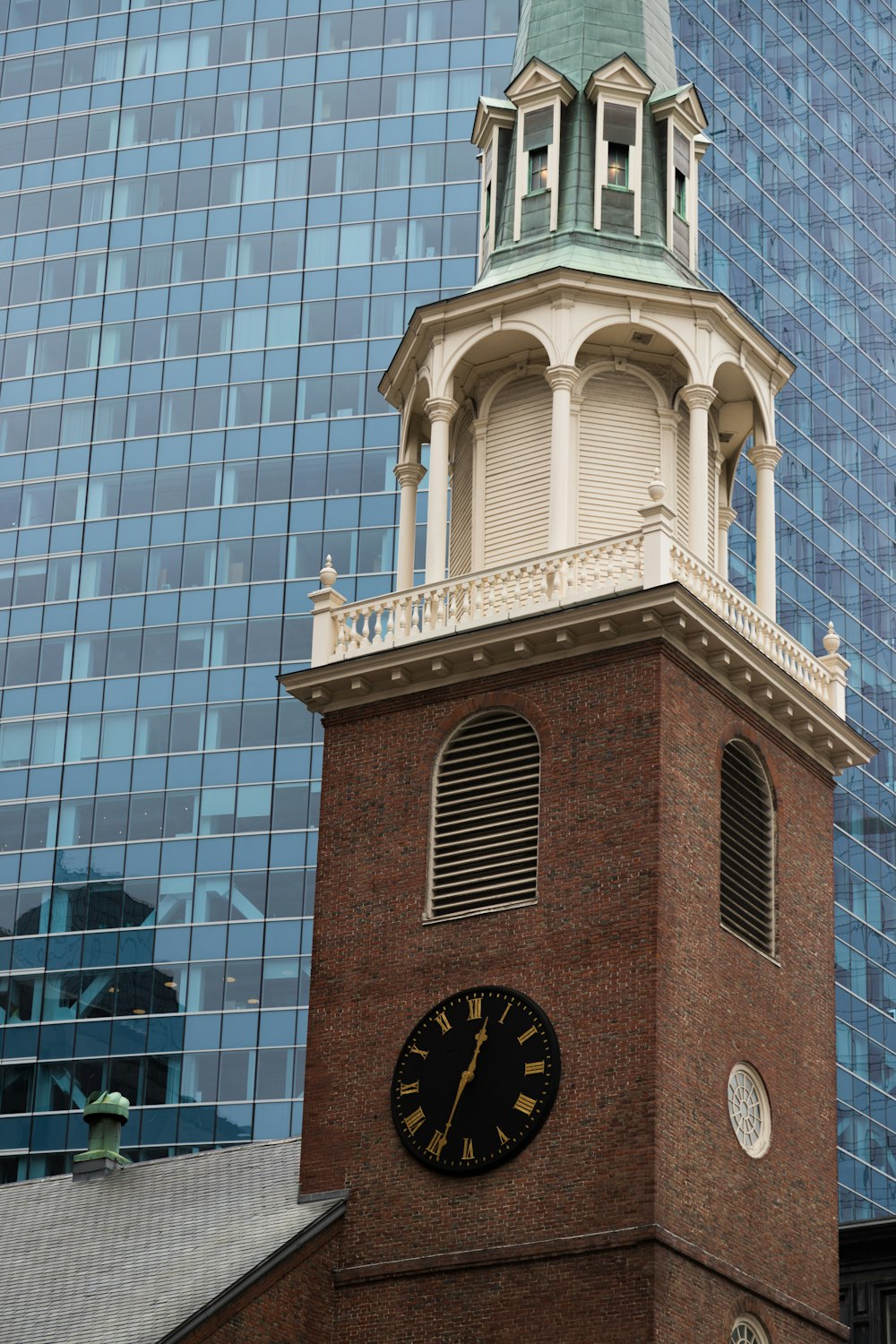 a clock on a brick building