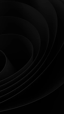 Abstract black curves forming a layered wavy pattern with soft shadows