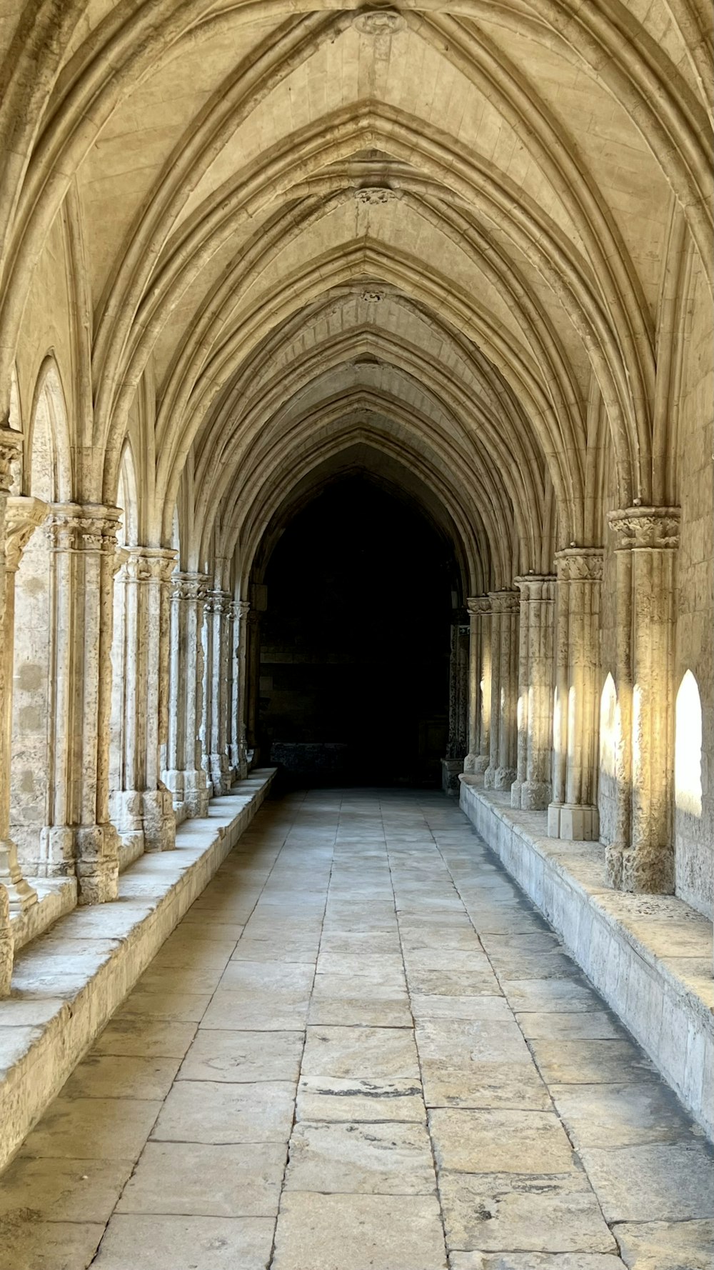 a stone walkway with arches
