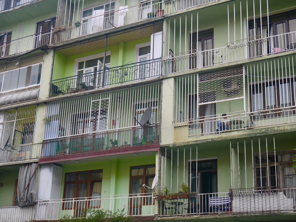 a person sitting on a balcony