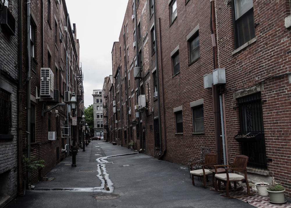 a street with brick buildings with Beacon Hill in the background