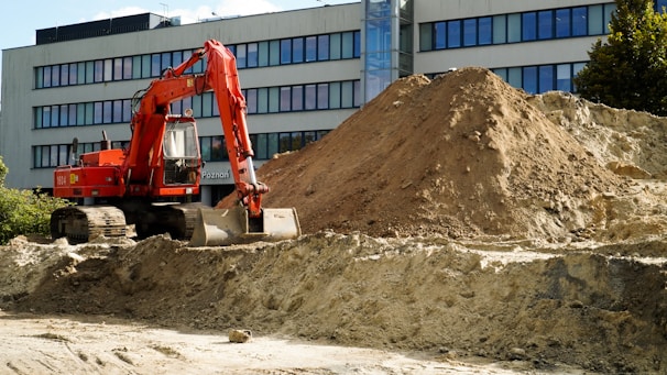 a construction vehicle in front of a building