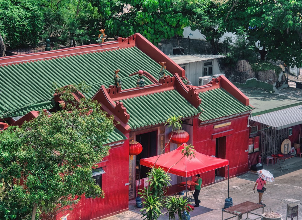 a red building with a red umbrella