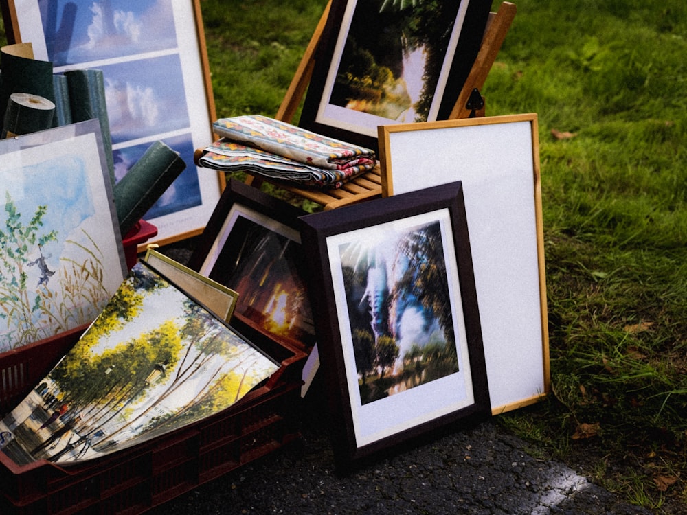 a group of framed pictures on a table