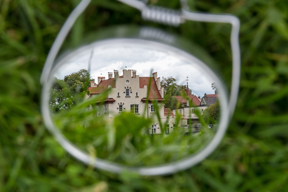 a view through a window of a house through a circular window