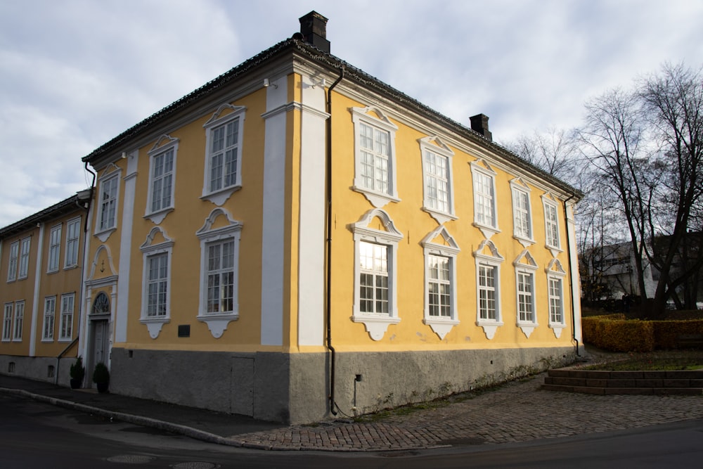 a yellow building with windows