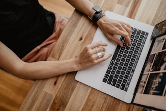 a person typing on a laptop