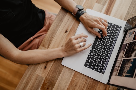 a person typing on a laptop