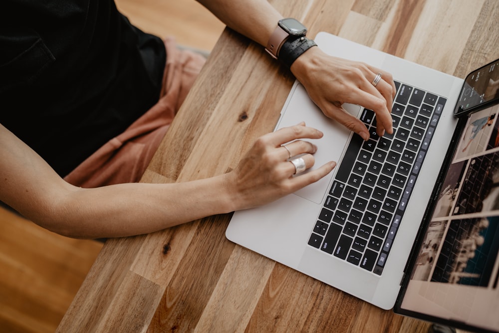 a person typing on a laptop