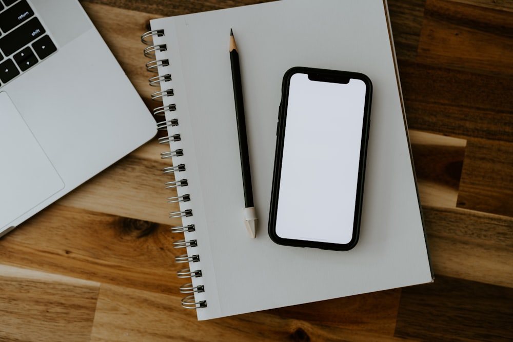 a white cell phone on a white box