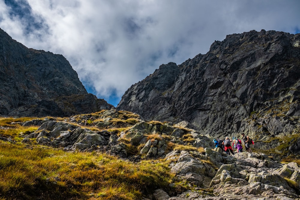 a group of people hiking in the mountains