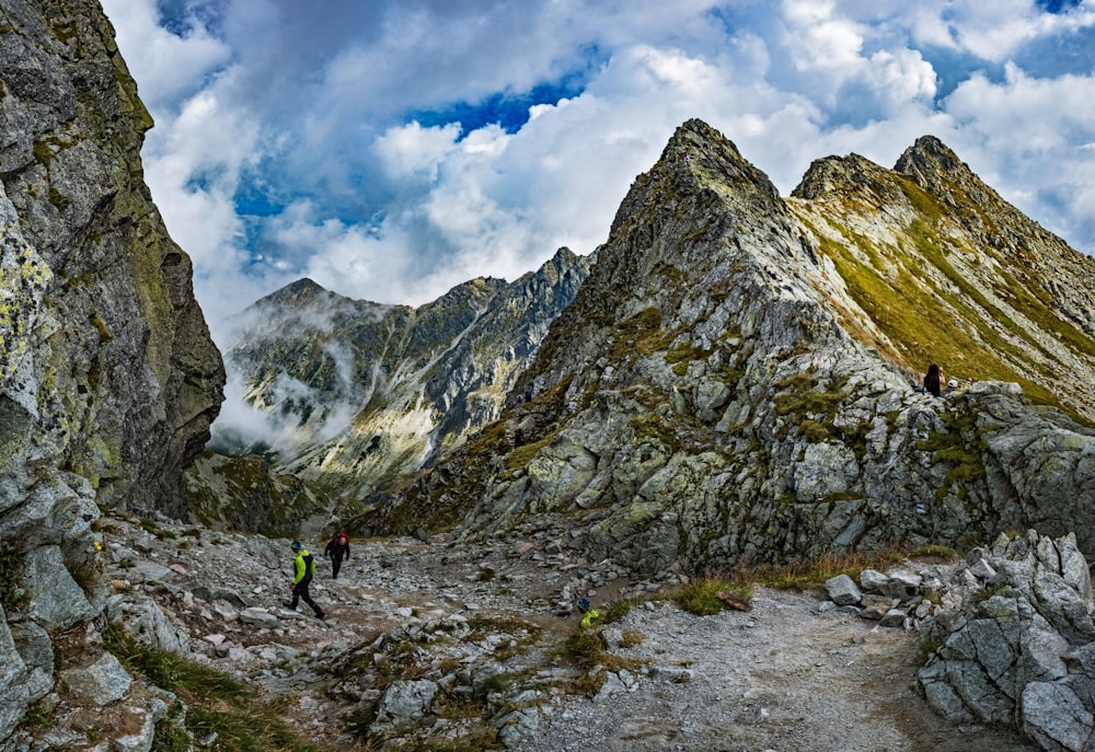 people hiking in a rocky area