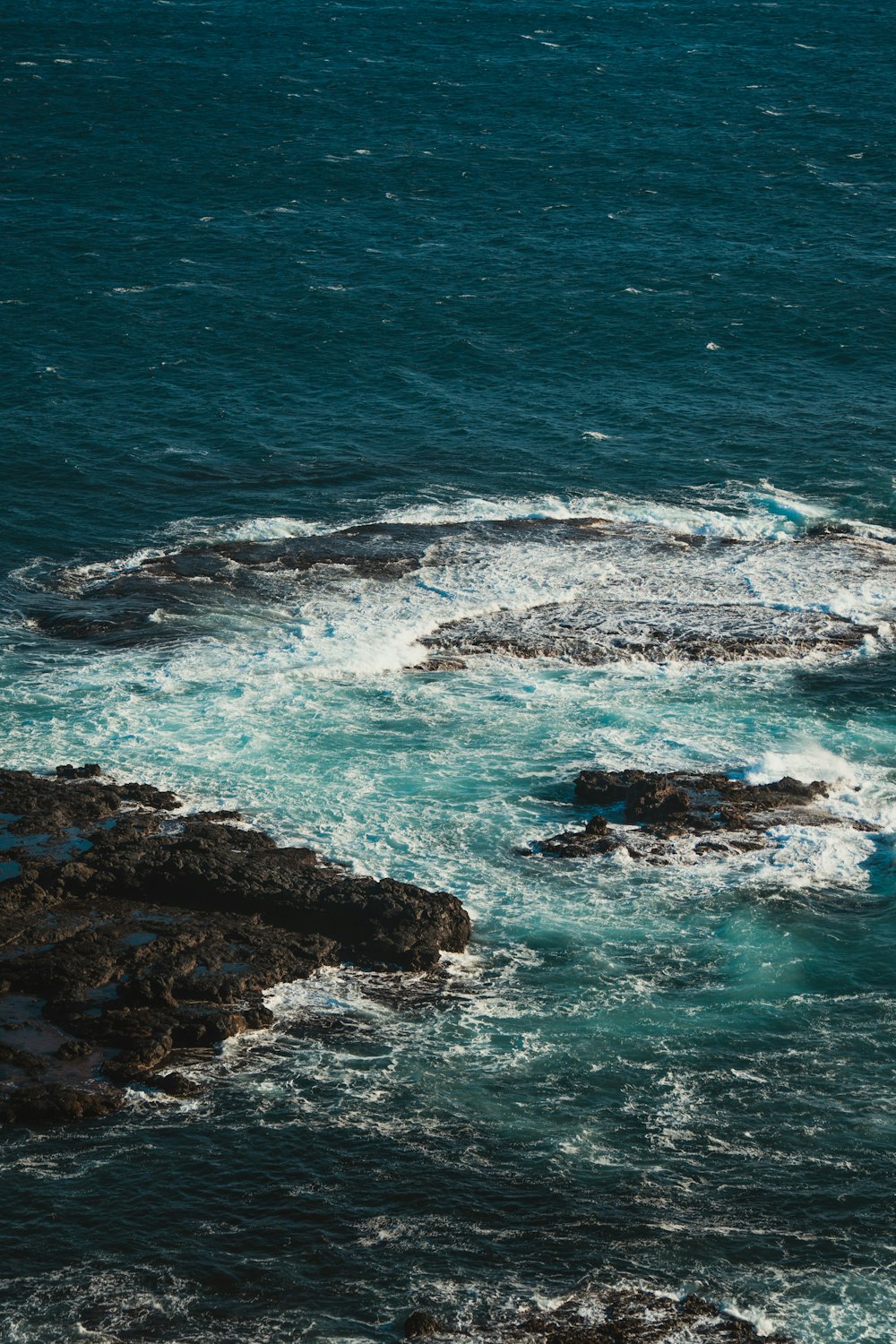 a rocky beach with waves crashing