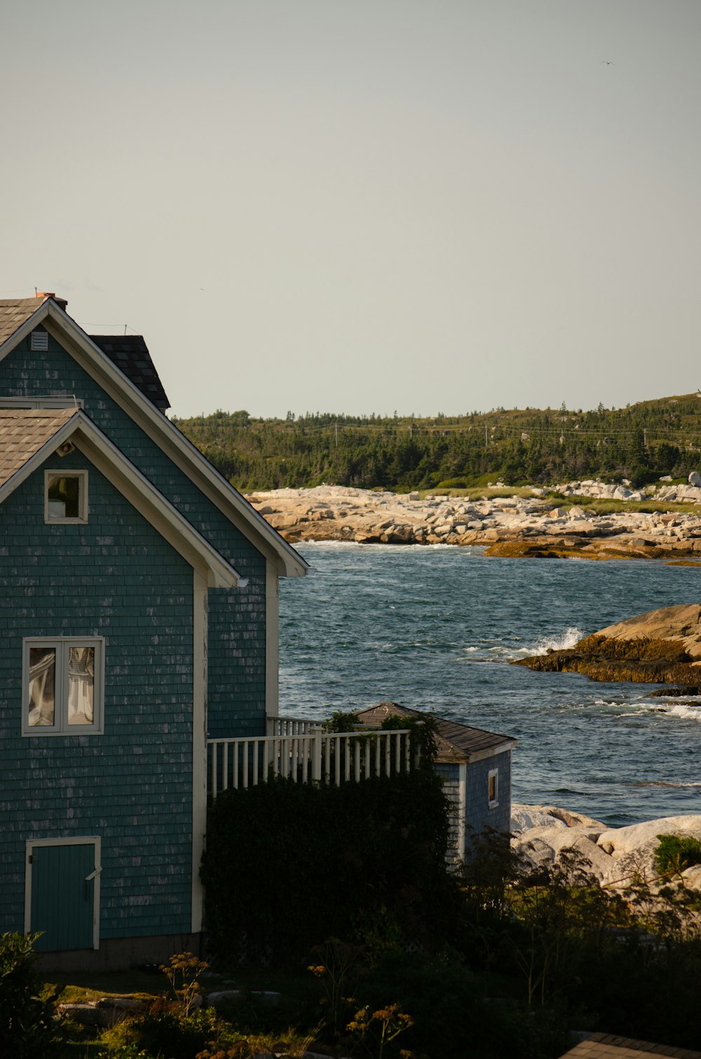 a house next to a body of water