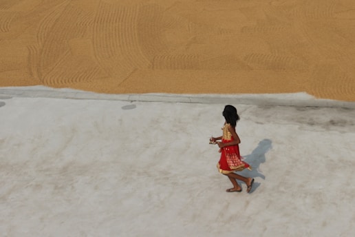 a person walking in the sand