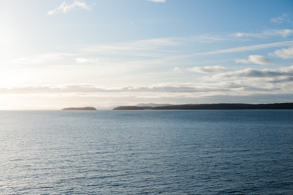 a body of water with land in the distance