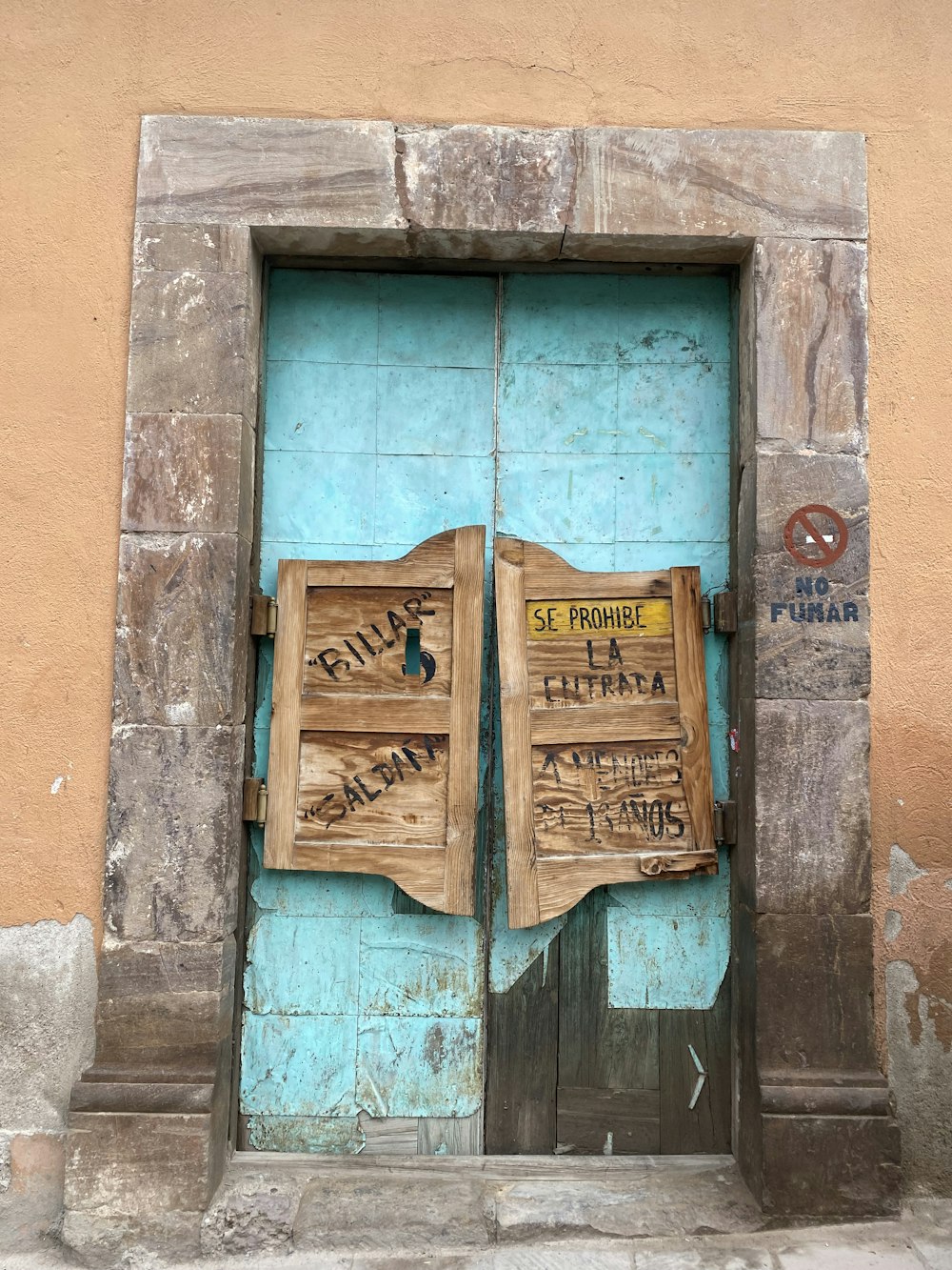 a blue door with writing on it