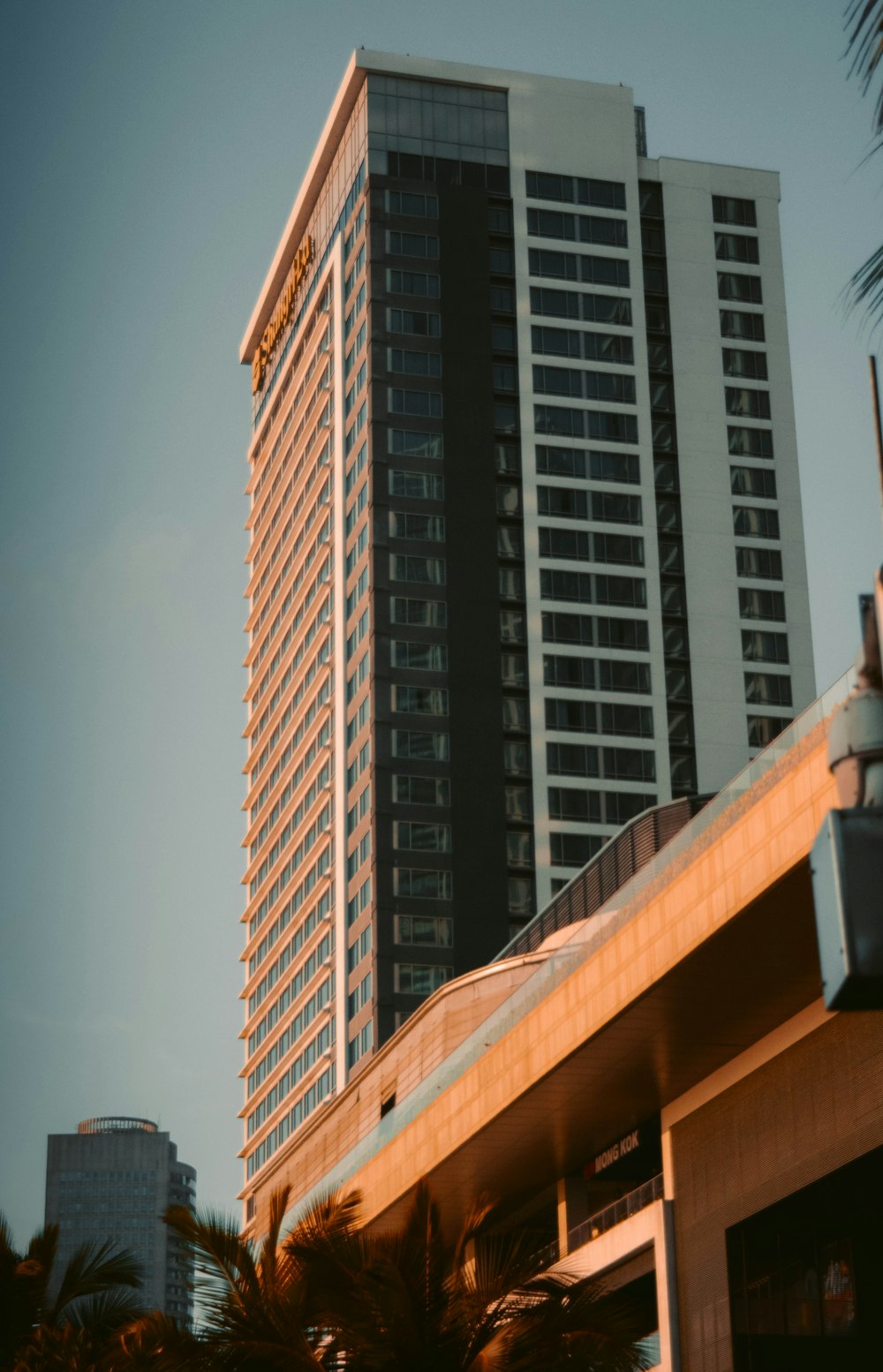 a tall building with a glass front