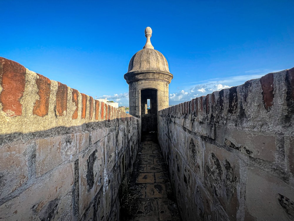 a stone wall with a tower