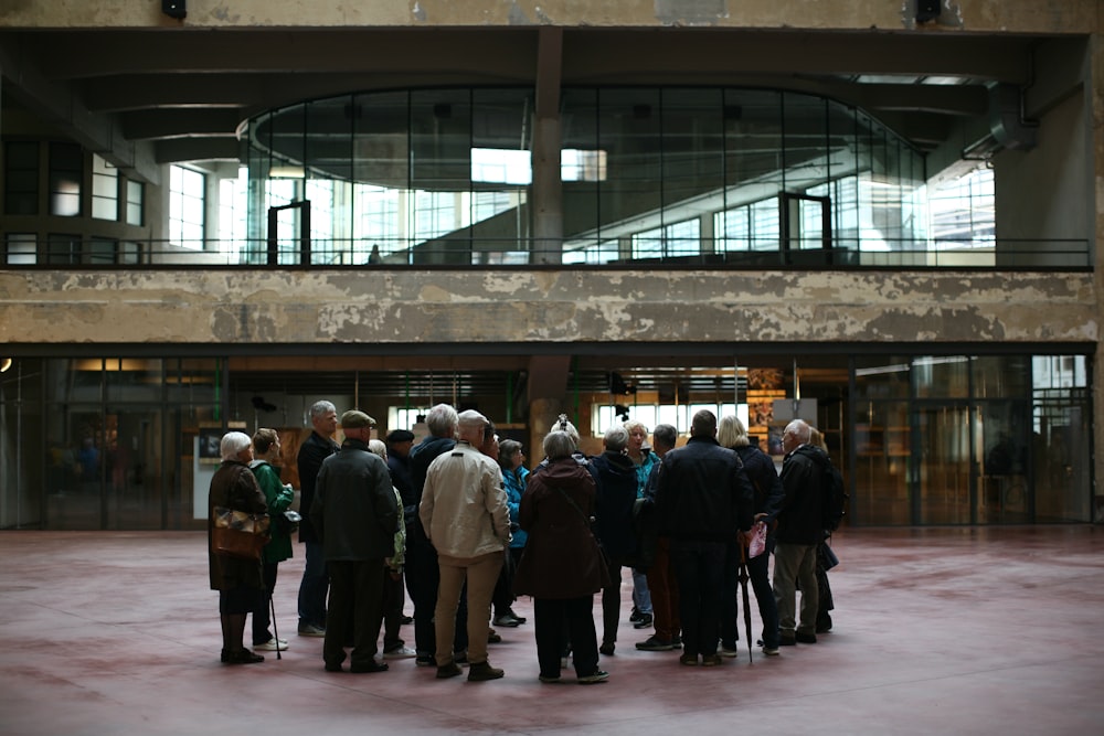 a group of people standing in front of a building