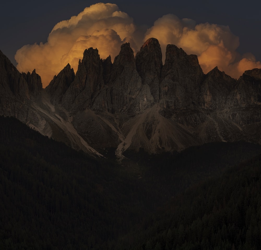 a mountain range with clouds