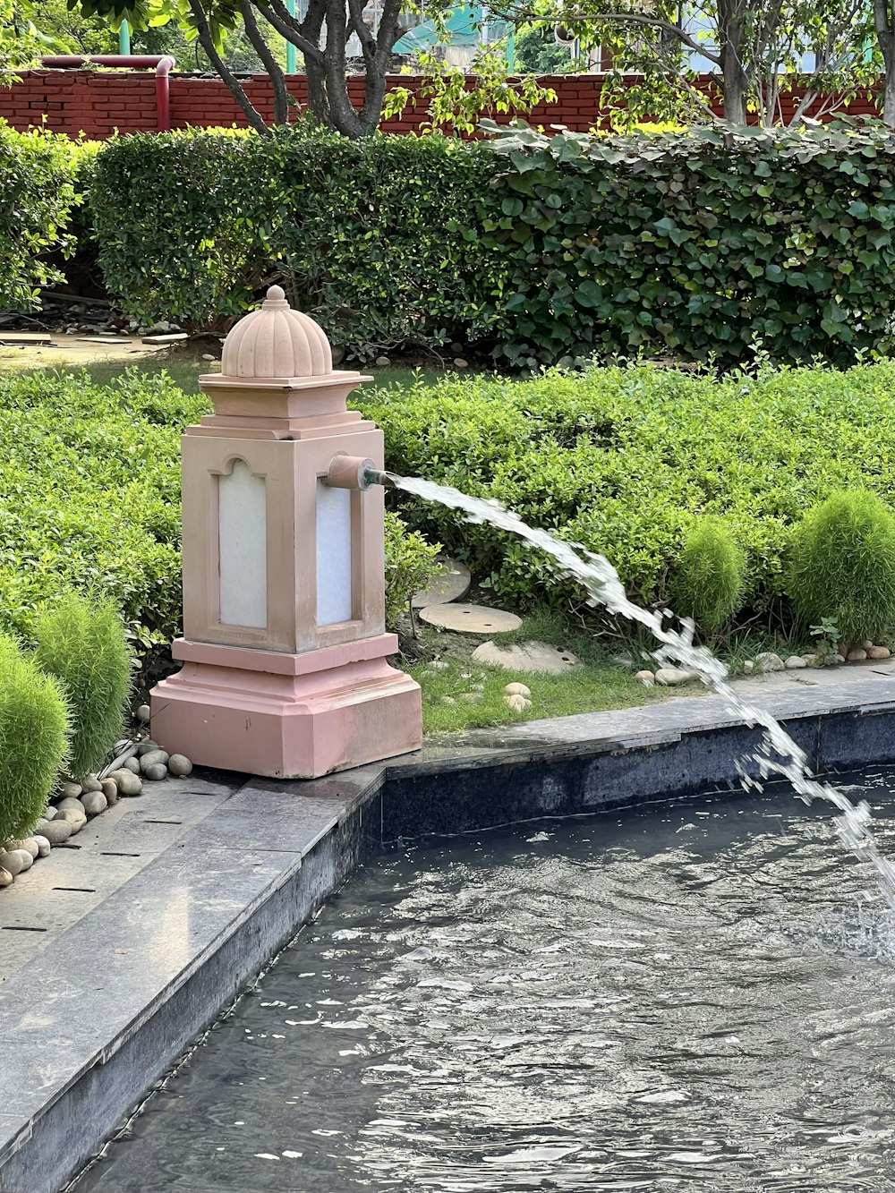 a water fountain in a garden