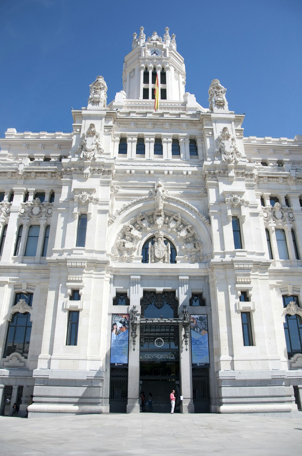 a large white building with statues