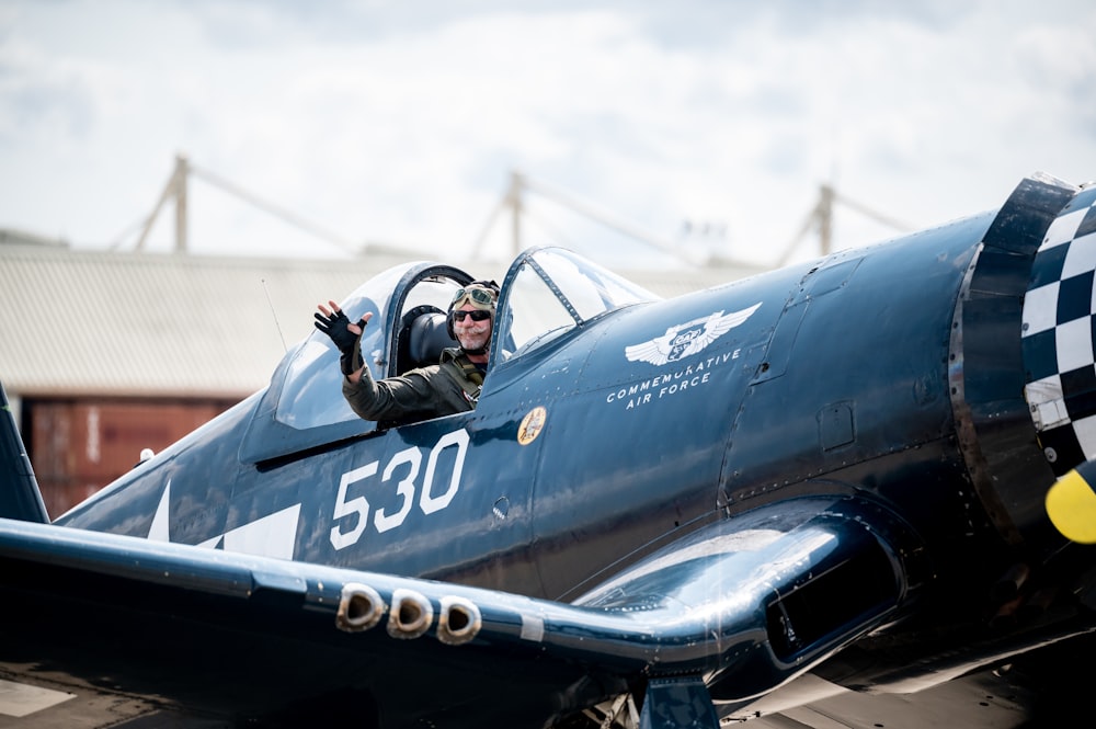 a person in a black airplane