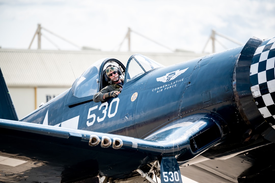 a person in a cockpit of a plane,