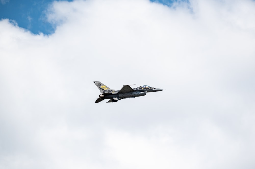 two fighter jets fly through the air