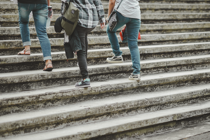 people walking up a flight of stairs