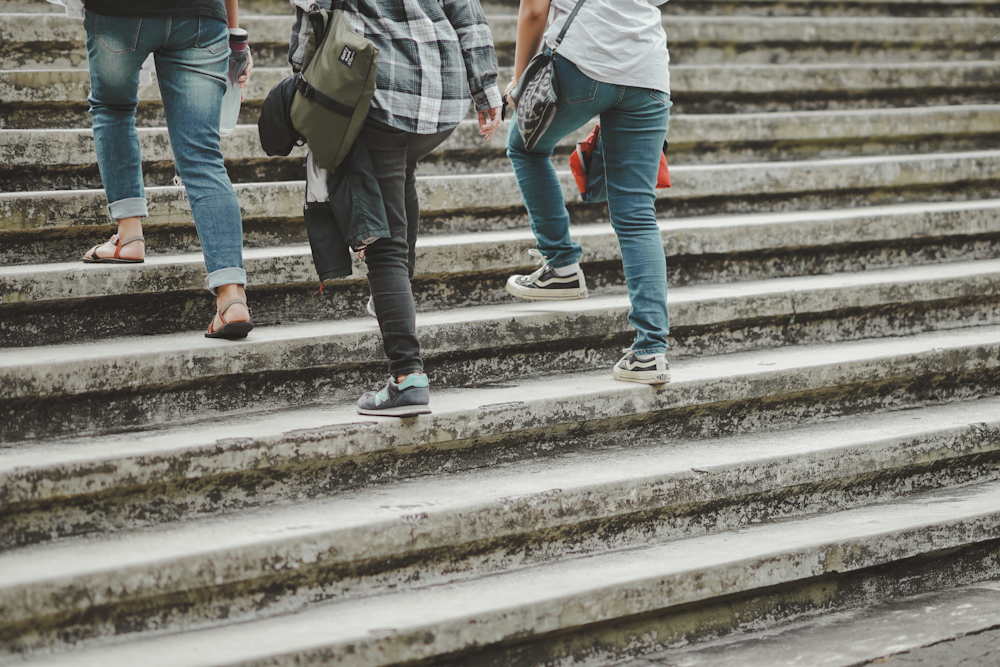 people walking up a flight of stairs