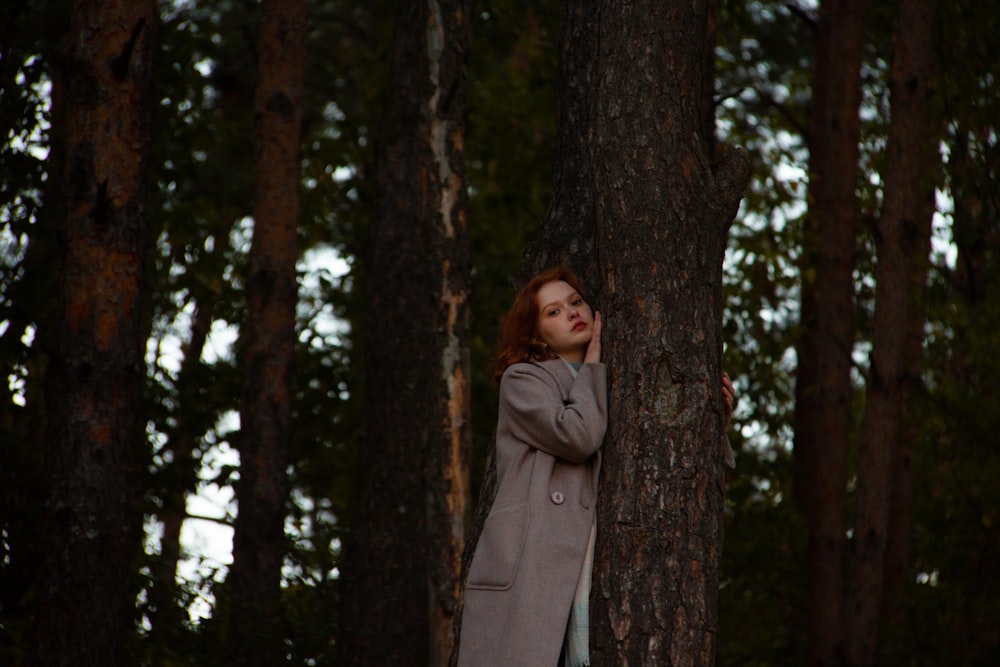 a person standing between trees