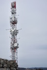a tower with a red and white antenna
