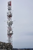 a tower with a red and white antenna