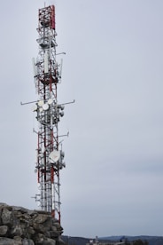 a tower with a red and white antenna