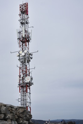 a tower with a red and white antenna