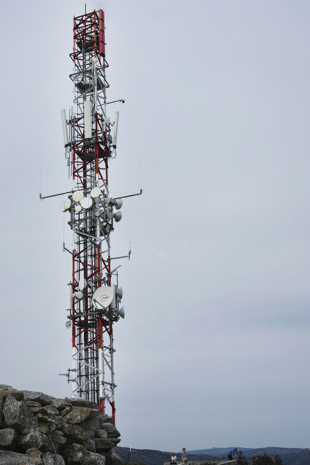 a tower with a red and white antenna