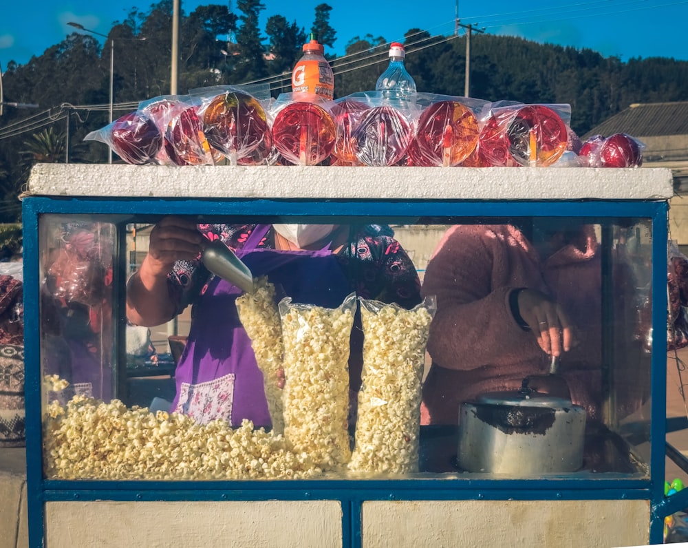 a group of people in a food stand