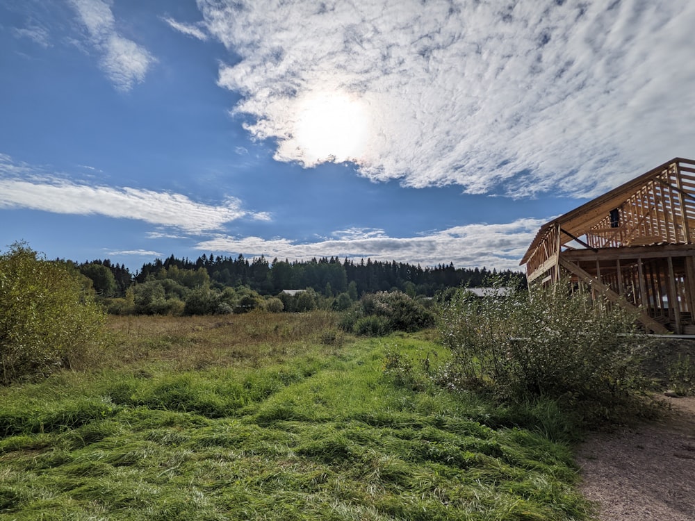 a wooden building on a hill