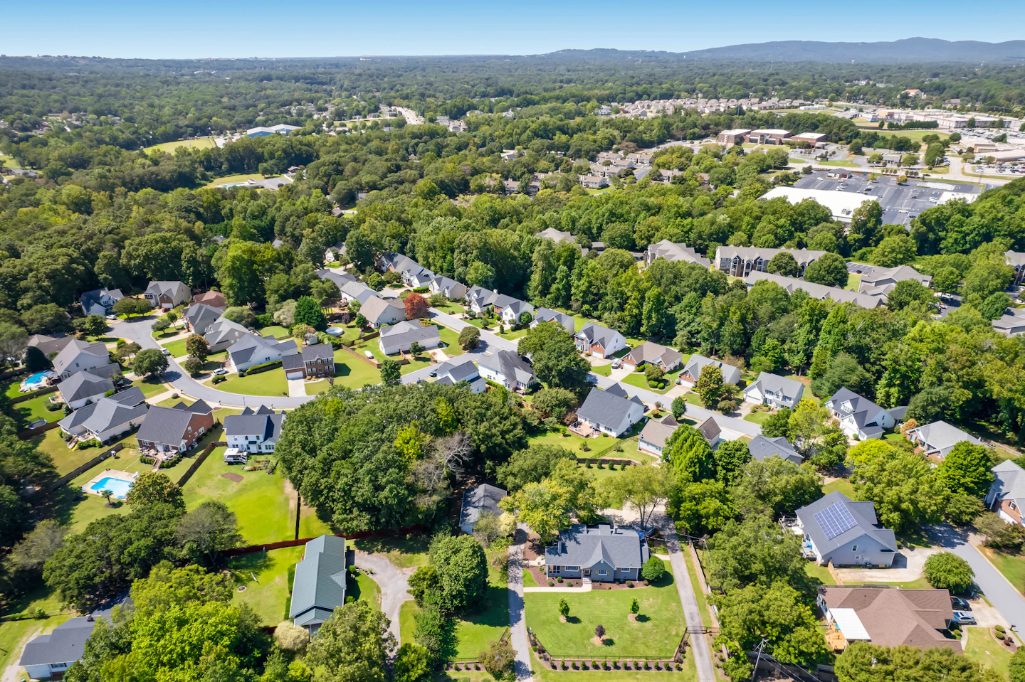 Aerial view of a leafy suburban neighborhood