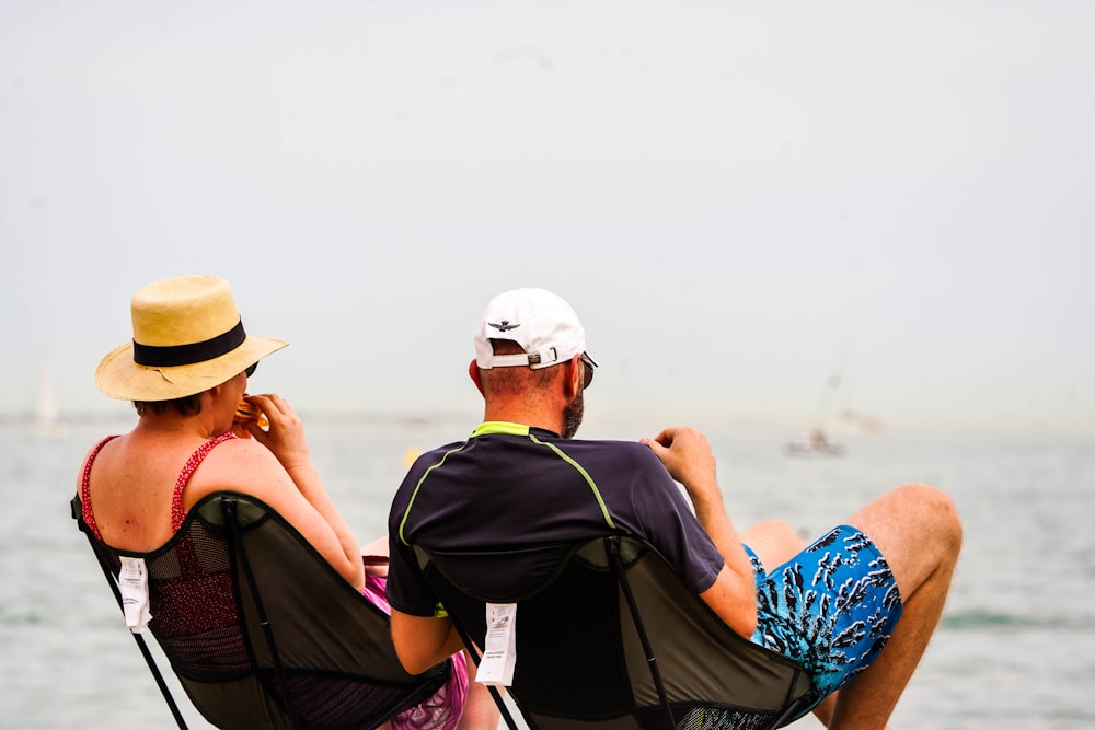 a man and woman sitting on a boat