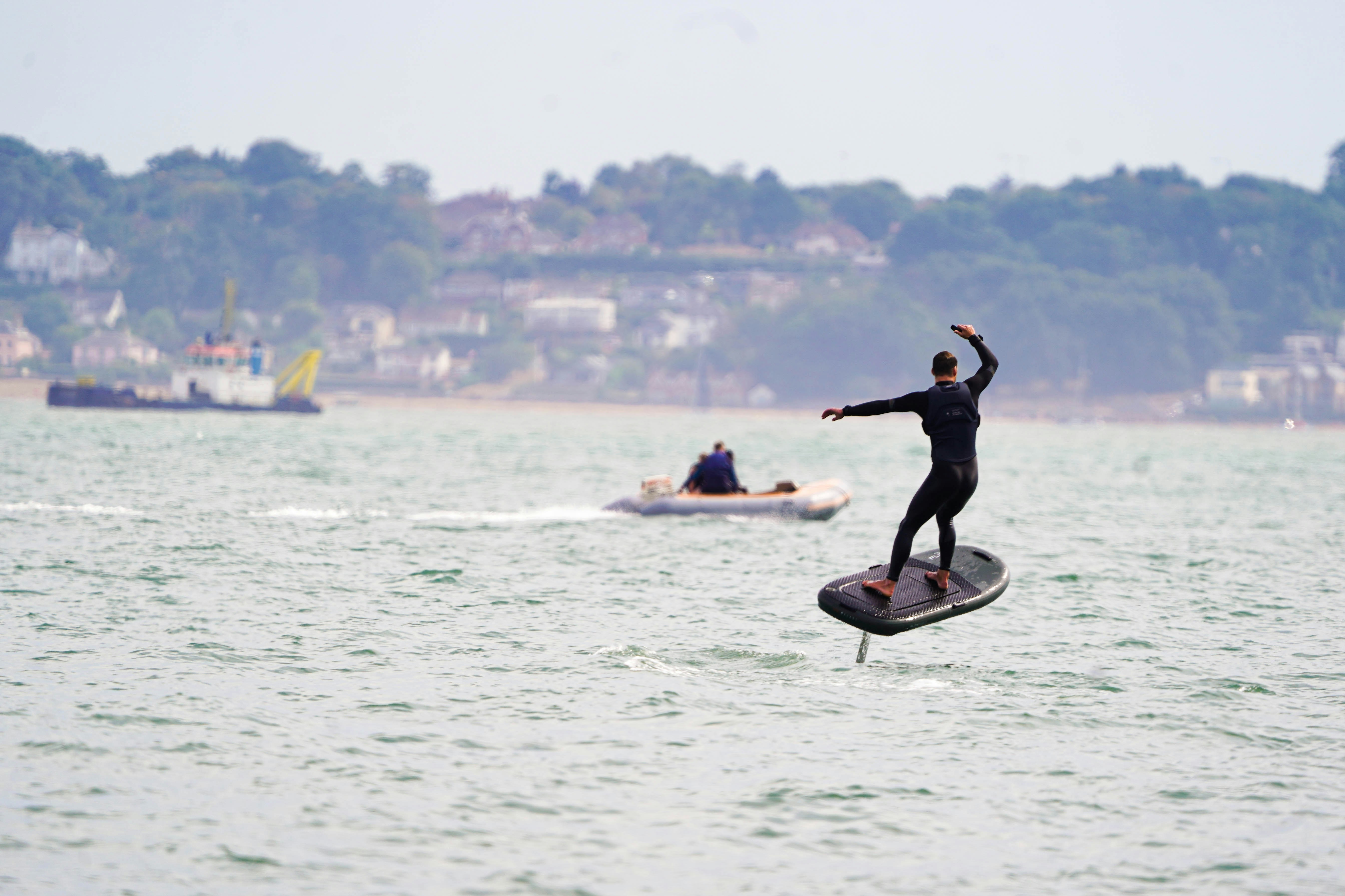 a man riding a surfboard