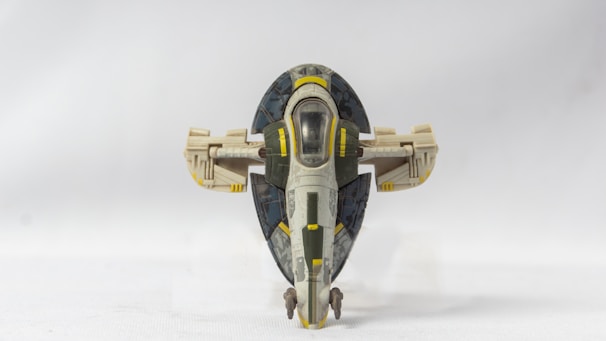 A detailed model of a spacecraft displayed on a table.