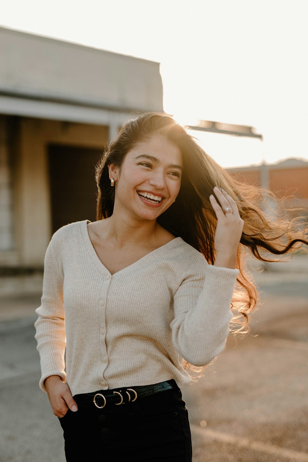 a woman with her hair blowing in the wind